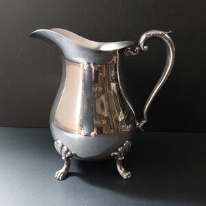 Crescent Footed Pitcher with Ornate Handle